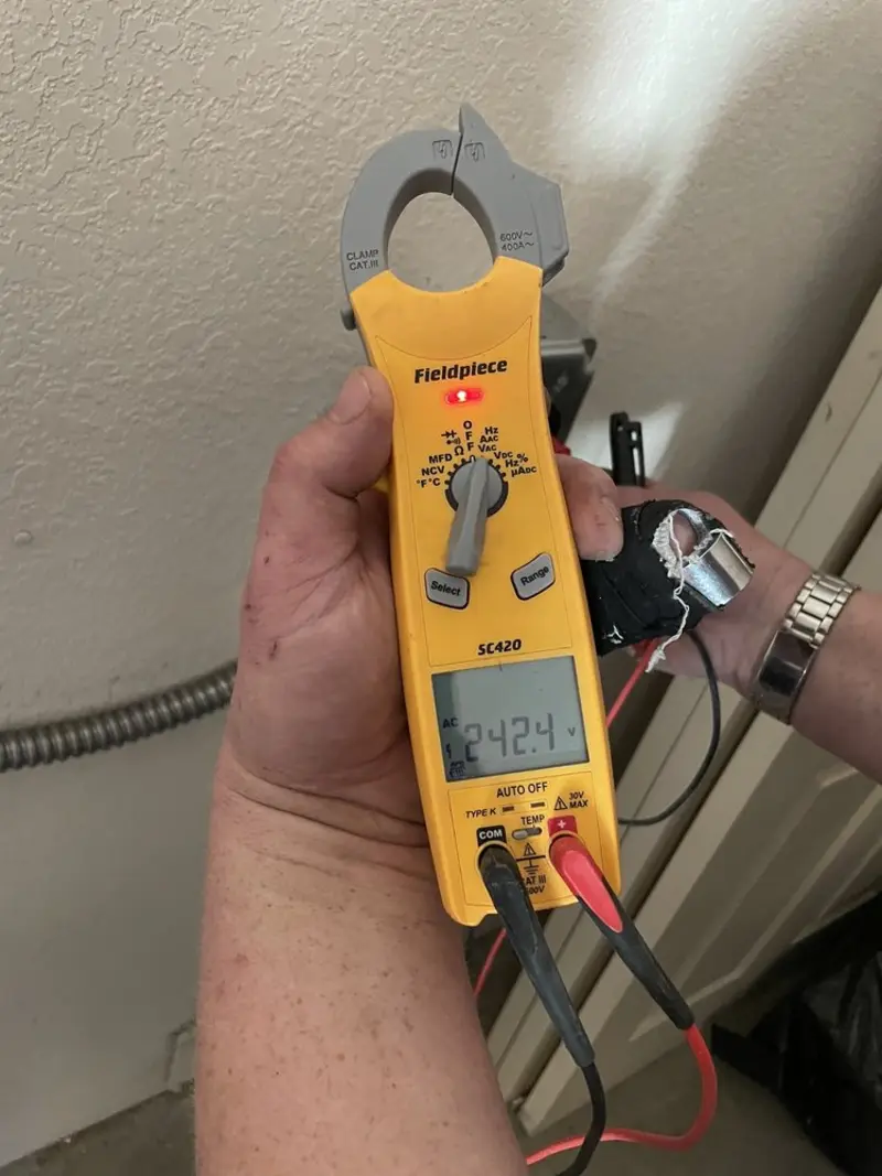 Voltage testing with clamp meter during Electrical Installation Services in Mattapoisett